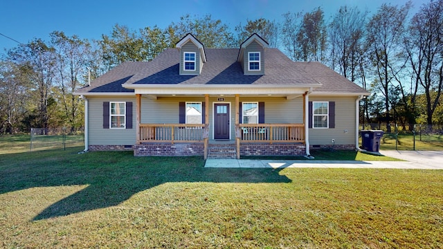 view of front of home with covered porch and a front yard