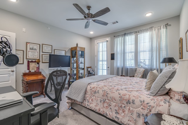 bedroom featuring ceiling fan and carpet