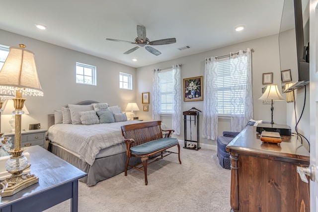 bedroom featuring light carpet and ceiling fan