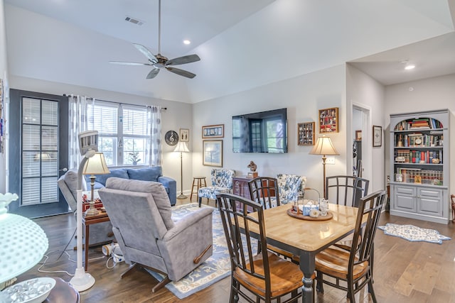 dining area featuring lofted ceiling, hardwood / wood-style floors, and ceiling fan