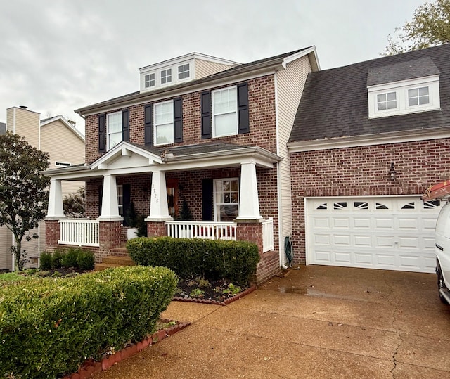 view of front of house with a garage and covered porch