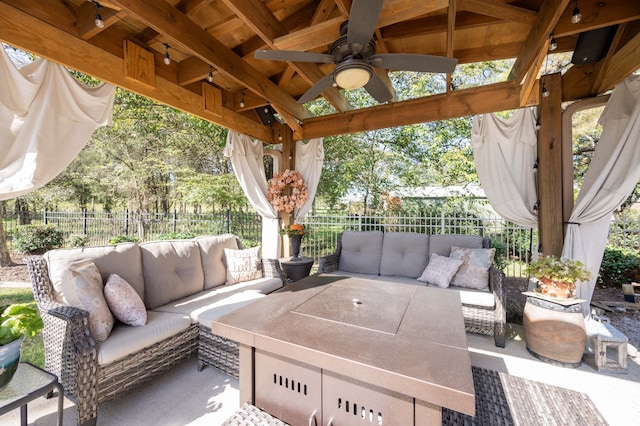 view of patio with ceiling fan, an outdoor hangout area, and a gazebo