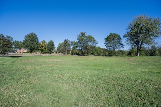 view of yard with a rural view