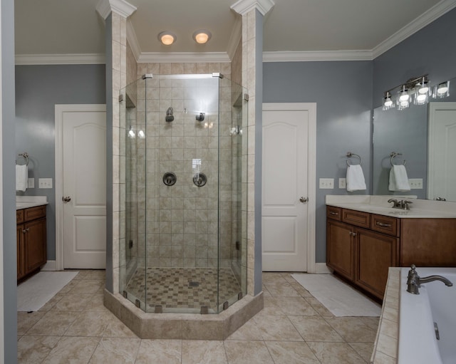 bathroom featuring ornamental molding, separate shower and tub, decorative columns, and vanity