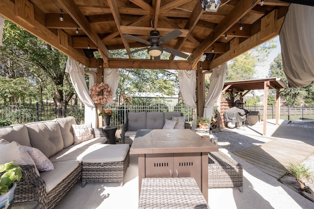 view of patio / terrace featuring a gazebo, ceiling fan, and an outdoor hangout area