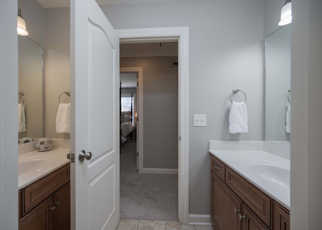 bathroom featuring tile patterned flooring and vanity