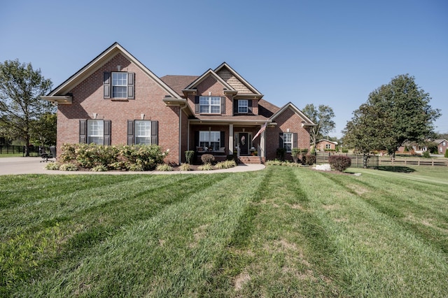 craftsman-style home featuring a front yard