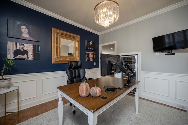 office with a chandelier, crown molding, and hardwood / wood-style flooring