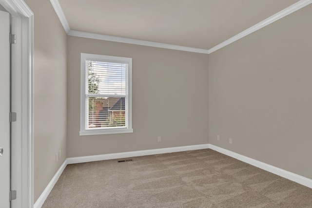 unfurnished room with light colored carpet and crown molding