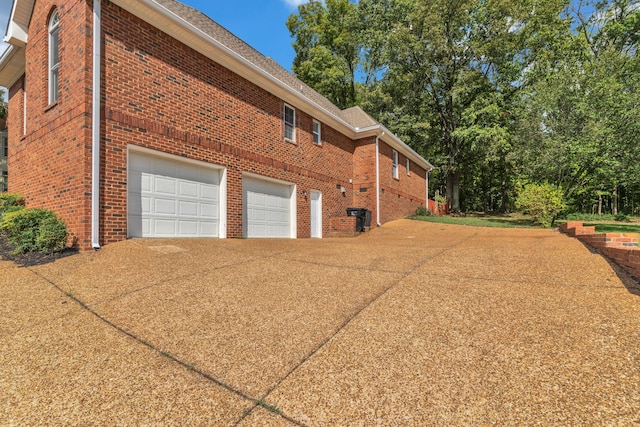 view of side of property with a garage