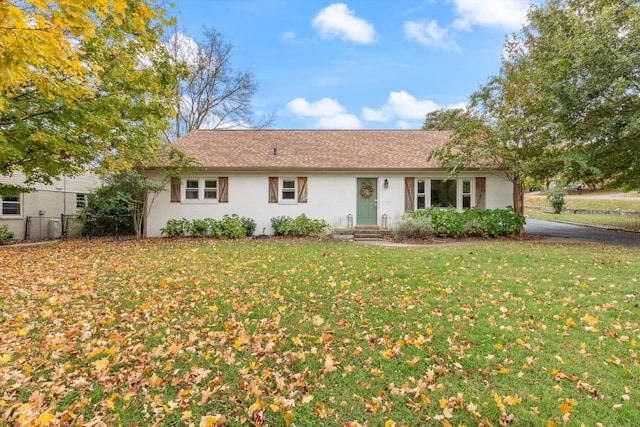 ranch-style home with a front yard