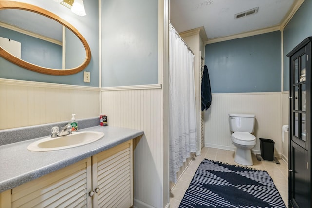 full bath featuring wainscoting, tile patterned flooring, vanity, toilet, and visible vents