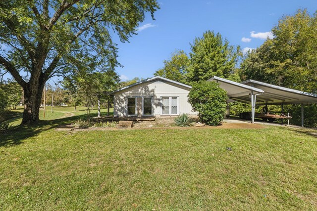 view of yard featuring a carport