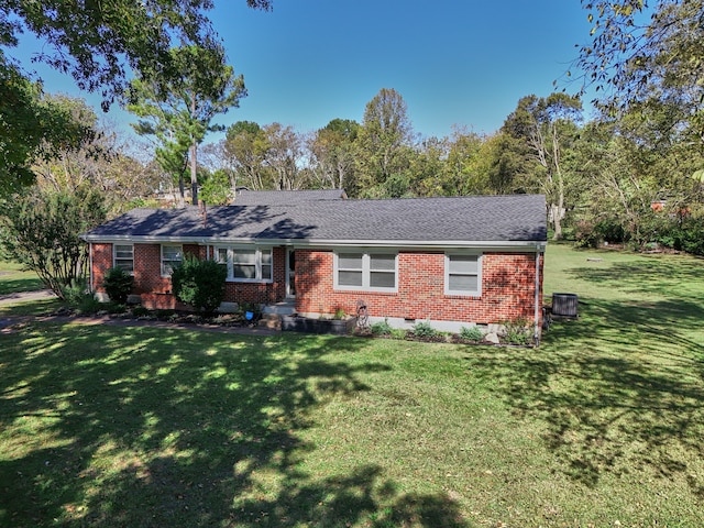 single story home with central AC unit and a front lawn