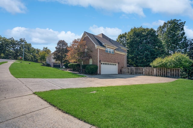 view of property exterior featuring a garage and a lawn