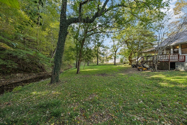 view of yard featuring a wooden deck