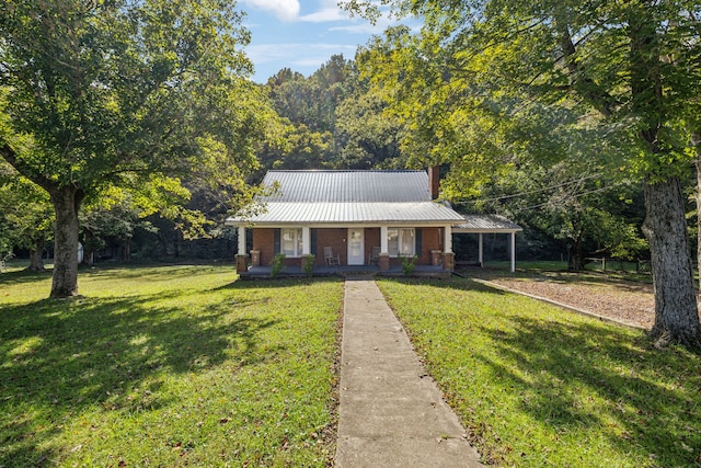 view of front of house with a front yard and covered porch