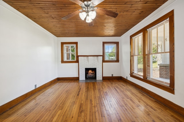 unfurnished living room featuring ceiling fan, wood ceiling, crown molding, and light hardwood / wood-style flooring