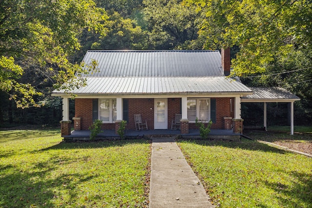 view of front of home with a front yard and covered porch