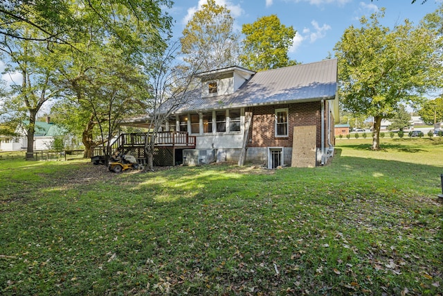 back of house with a lawn