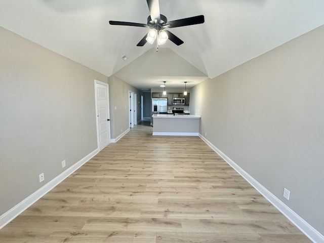 unfurnished living room with ceiling fan, light wood-type flooring, and high vaulted ceiling