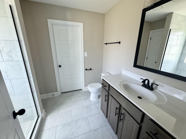 bathroom with toilet, vanity, and walk in shower