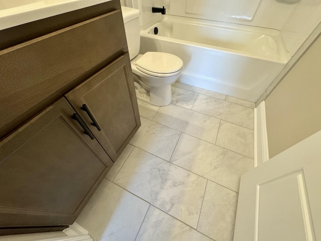 bathroom featuring toilet and vanity