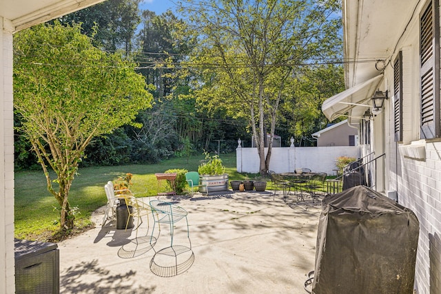 view of patio featuring a grill