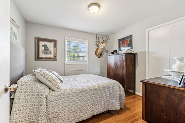 bedroom with hardwood / wood-style flooring