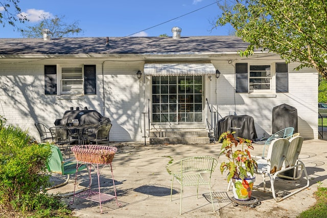 rear view of property with a patio area