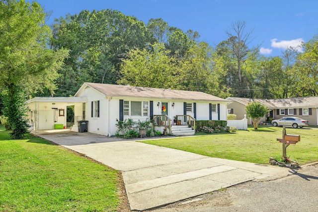 ranch-style house featuring a carport and a front yard