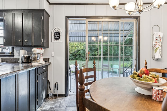 dining space featuring plenty of natural light and an inviting chandelier