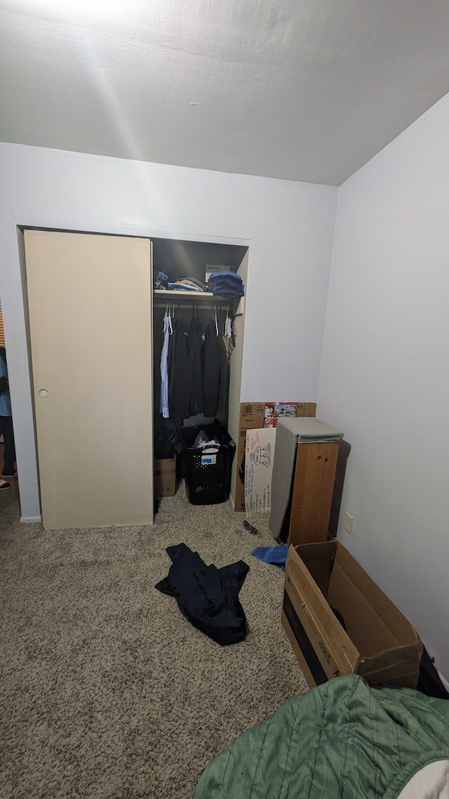 bedroom featuring a closet and carpet