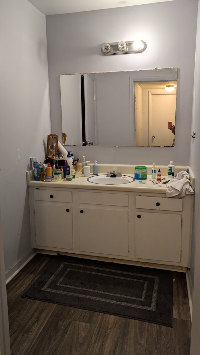 bathroom featuring wood-type flooring and vanity