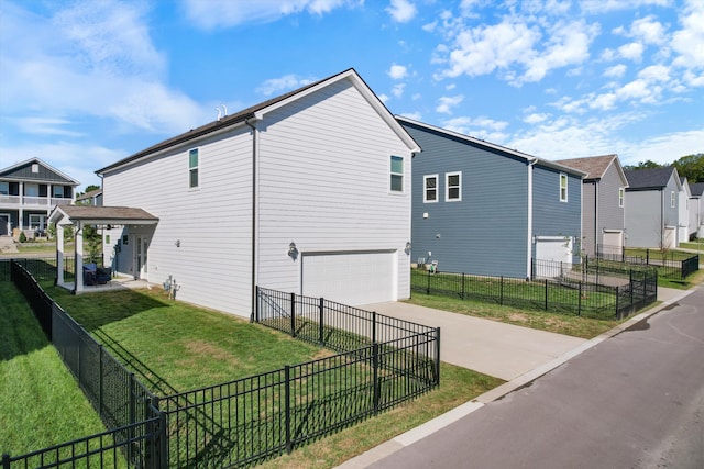 view of home's exterior featuring a garage and a lawn