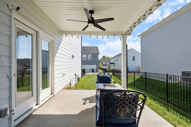 view of patio featuring ceiling fan