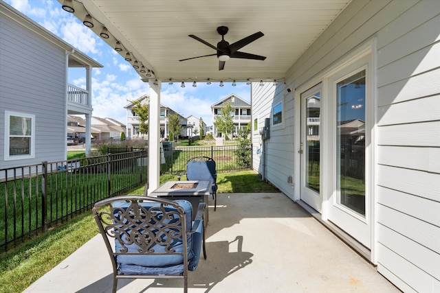 view of patio featuring ceiling fan