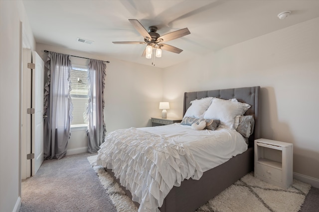 bedroom with light colored carpet and ceiling fan