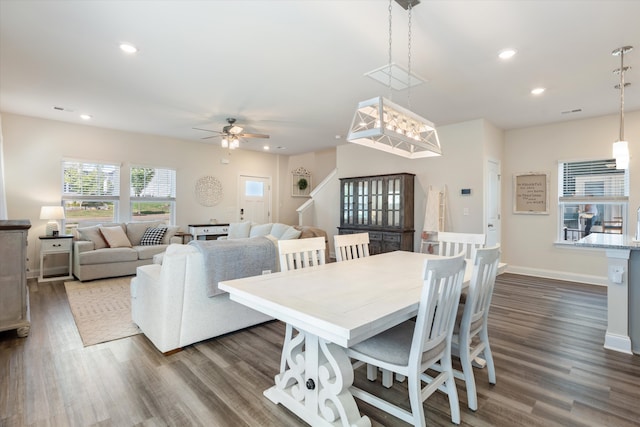 dining room featuring dark hardwood / wood-style floors and ceiling fan