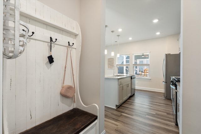 mudroom with sink and dark hardwood / wood-style flooring