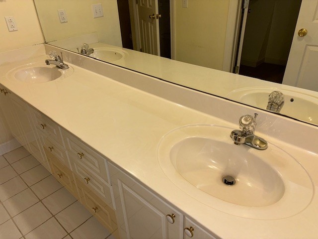 bathroom with vanity and tile patterned floors