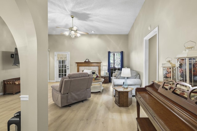 455 Bluff View Dr, Spencer, TN 38585 - living area with arched walkways, light wood-style floors, and a ceiling fan