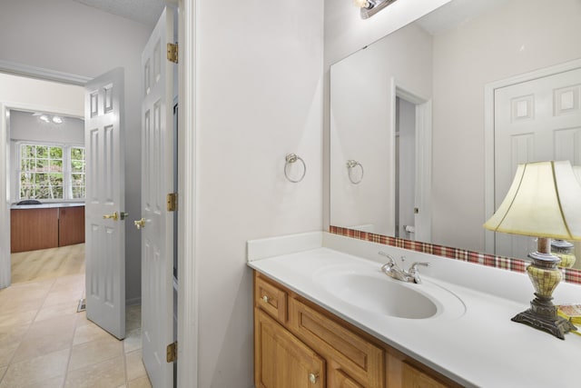 bathroom featuring tile patterned floors and vanity