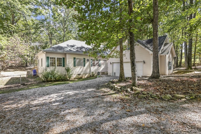 455 Bluff View Dr, Spencer, TN 38585 - view of front of home featuring driveway, roof with shingles, and an attached garage