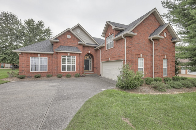 view of front facade featuring a garage and a front lawn