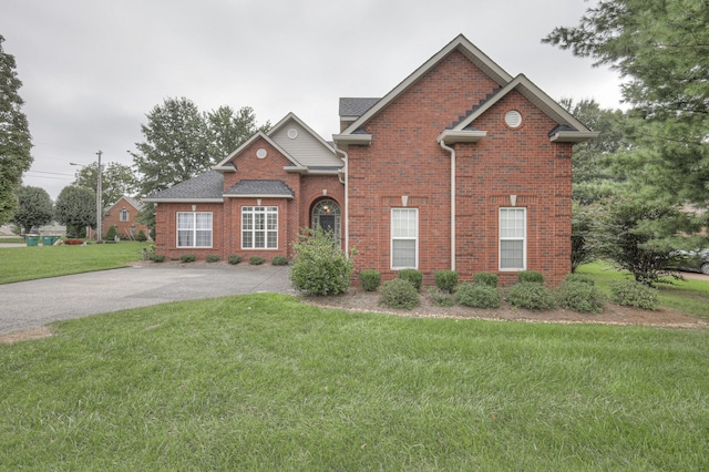 view of property featuring a front yard