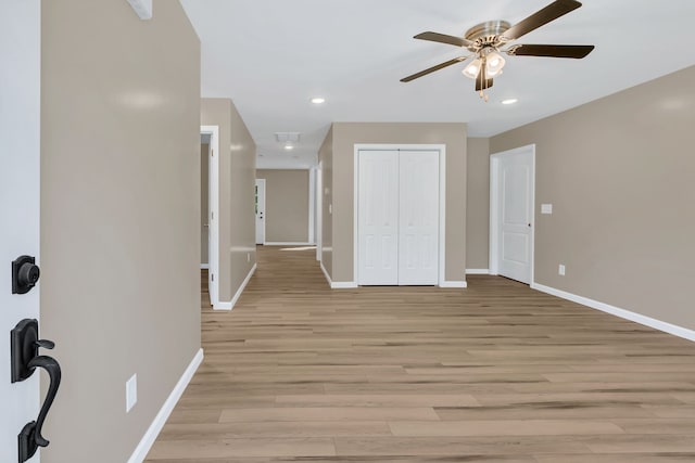 interior space featuring light wood-type flooring and ceiling fan