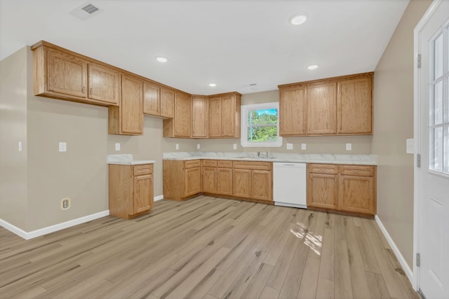 kitchen featuring sink, light hardwood / wood-style flooring, and white dishwasher