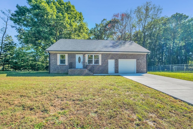 view of front of property with a garage and a front lawn