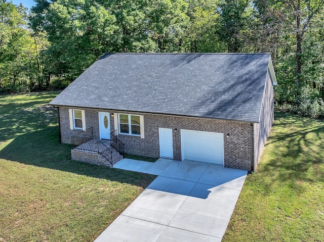 view of front facade with a front yard and a garage